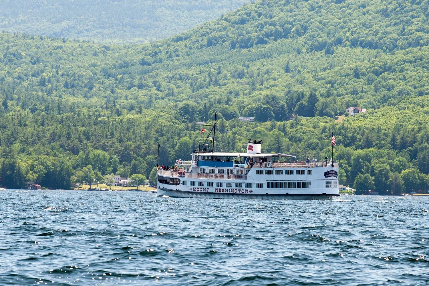 The M/S Mount Washington cruise ship on Lake Winnipesaukee near Rattlesnake Island, mountains in the background